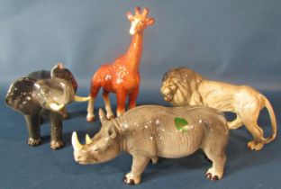 A Melba ware giraffe, rhinoceros, elephant and a lion