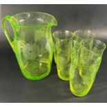 A Uranium glass lemonade jug and five glasses etched with summer flowers, five art deco style gilded