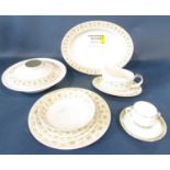 A Doulton Samarra dinner service comprising graduated plates, two tureens, open bowl, gravy boat and