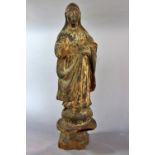 A19th century oriental carved wooden figure of the Madonna , broken in places and traces of