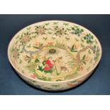 A circular Japanese bowl with character and foliate detail, a cloisonné dish with lobed border,