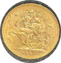 Victorian gold sovereign dated 1891, circulated, contained in a circular container
