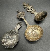 A George IV scalloped and floral embossed caddy spoon, Birmingham 1826, maker Joseph Wilmore, with