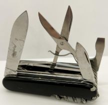 A cased Victorinox hand tool with approximately 13 tools / implements