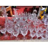 A large quantity of cut glass including wine glasses, brandy glasses etc fruit bowls, a rose bowl,
