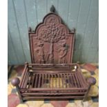 A cast iron fire back of stepped arched form with raised relief detail, 48cm wide x 72cm high,