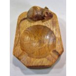 From the workshop of Robert `Mouseman’ Thompson a light oak ashtray with mouse signature. 10cm x
