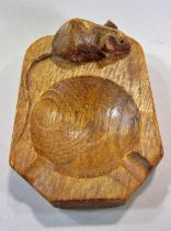 From the workshop of Robert `Mouseman’ Thompson a light oak ashtray with mouse signature. 10cm x