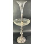 A late Victorian silver plated table centre epergne with a removable cut glass trumpet vase over a