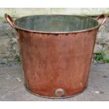 A 19th century copper tub of cylindrical tapering form with loop handles, 46 cm wide