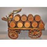 A model Young’s Brewery Cart with a load of fourteen beer barrels each stamped, 56cm x 23cm approx.