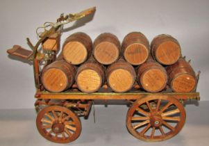 A model Young’s Brewery Cart with a load of fourteen beer barrels each stamped, 56cm x 23cm approx.