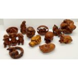 A collection of 22 hardwood polished netsuke, principally creatures, snakes, toads, rabbits, rats,