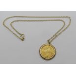 Sovereign dated 1887, mounted in a bright cut pendant mount, hung from a 9ct fancy link chain