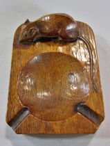 From the workshop of Robert `Mouseman’ Thompson a dark oak ashtray with mouse signature,10cm x