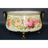 19th century continental porcelain jardinière of oval form with hand painted repeating floral