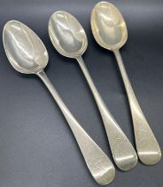 A mixed selection of 1930s silver flatware including five serving spoons, three dessert spoons, a