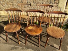 A set of five stained beech Swedish stickback kitchen chairs with circular seats