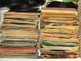A quantity of 45rpm singles (200 approx) together with a collection of Manchester United 'United