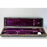 A Rundall Carte & Co rosewood flute no 502 in its original Moroccan leather case, 65 cm long (