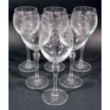 Six Victorian style etched wine glasses, an elegant Regency style claret jug and six Waterford cut