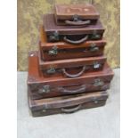 A stack of vintage leather and fibre luggage