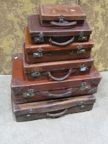 A stack of vintage leather and fibre luggage