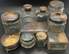 A group of silver vanity jars, different designs, various makers, together with a trinket box,