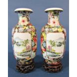 Pair of Chinese famille rose vases, Republic period, with black ground mille fleur decoration and