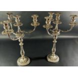 An impressive pair of Georgian style candelabra with a central column sconce and three entwined