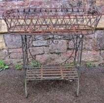 A good quality heavy gauge wirework garden/conservatory planter, on two open strapwork tiers, 52cm