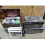 An old tin trunk containing various kitchenalia, a small painted plate rack, two further tin