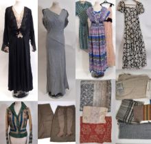 Large collection of mid 20th century clothing and fabric remnants contained in a lead lined wooden