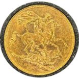 Victorian gold sovereign dated 1876, circulated, contained in a circular container