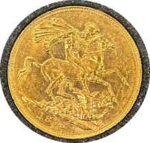 Victorian gold sovereign dated 1876, circulated, contained in a circular container