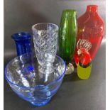 A mixed selection of mid to late 20th century glassware to include a tall red vase, a pale blue