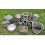 A collection of vintage galvanised and aluminium ware to include three watering cans, old bottle