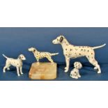 A collection of ceramic Dalmatians, to include two Beswick examples, a Wade example, a Spelter