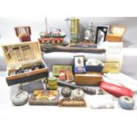 A miscellaneous collection of items including a model fishing boat, a model narrow boat, a