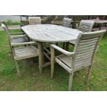 A good quality weathered teak Cotswold collection D end extending garden table with two bi-folding