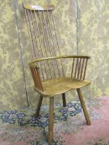 A Cardigan Welsh stick back chair by John Brown (1933-2008) in elm and ash, with Celtic cross