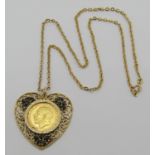 Sovereign dated 1912 in 9ct heart pendant mount set with sapphires, hung on a 9ct chain necklace,