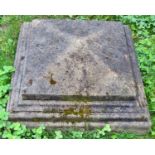 A weathered composition stone pier cap of stepped form, 50cm square, together with a pair of