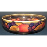 A Moorcroft bowl with pomegranate pattern, the foot with silver plated mount, together with a