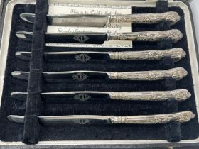 A cased set of six silver handled cake forks and a set of six similar cake knives, a single silver