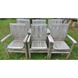 A set of six good quality Bramblecrest weathered teak garden open armchairs with slatted seats and