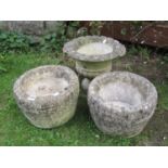 A pair of weathered cast composition garden planters in the form of coopered half barrels, 30 cm