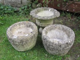 A pair of weathered cast composition garden planters in the form of coopered half barrels, 30 cm