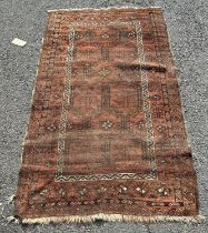 An old faded Bijar rug with a geometric pattern to the central, 173cm x 98cm