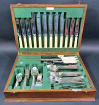 An oak Walker & Hall canteen of silver plated cutlery for six settings (one dessert spoon